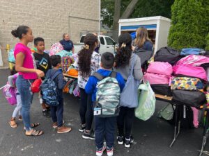 Mercy Center Prepares Families for “Back to School” – with Backpacks and Supplies!