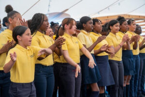 Sisters Academy students perform for guests at the school’s Spring Luncheon fundraising event.