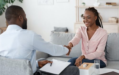 Nice To Meet You. Male therapist greeting black woman at counselling session
